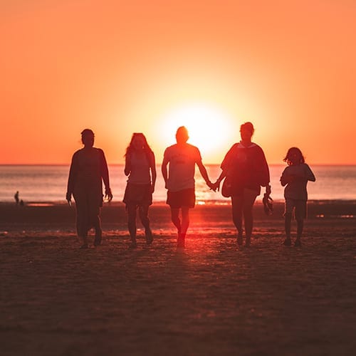Inheritance Tax - family walking down the beach