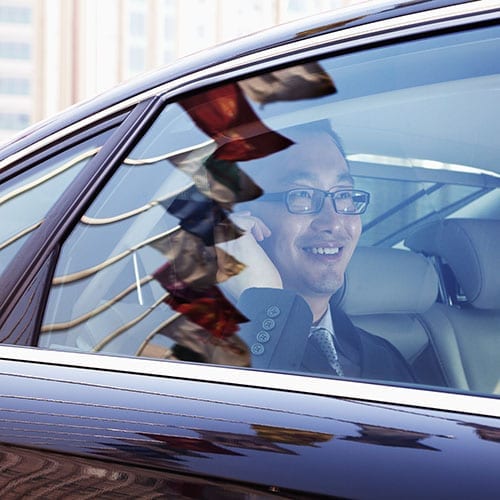 China Desk image - Chinese man in a car going to a business meeting