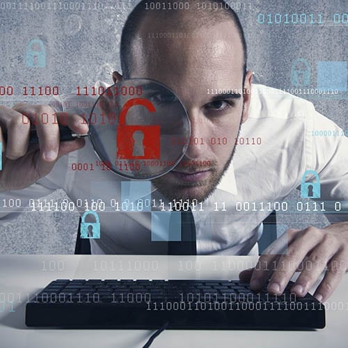 Cyber Sercurity Services - Man looking through a microscope