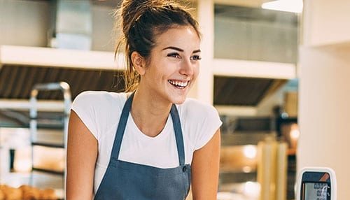 Food and drink image - small business owner serving in her bakery
