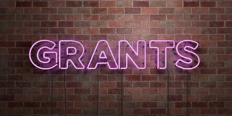 grants written in pink neon lighting