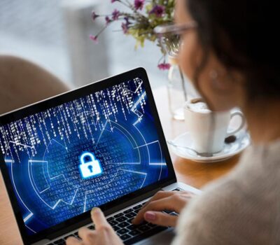 Cyber Security Woman On Laptop With Padlock On Screen