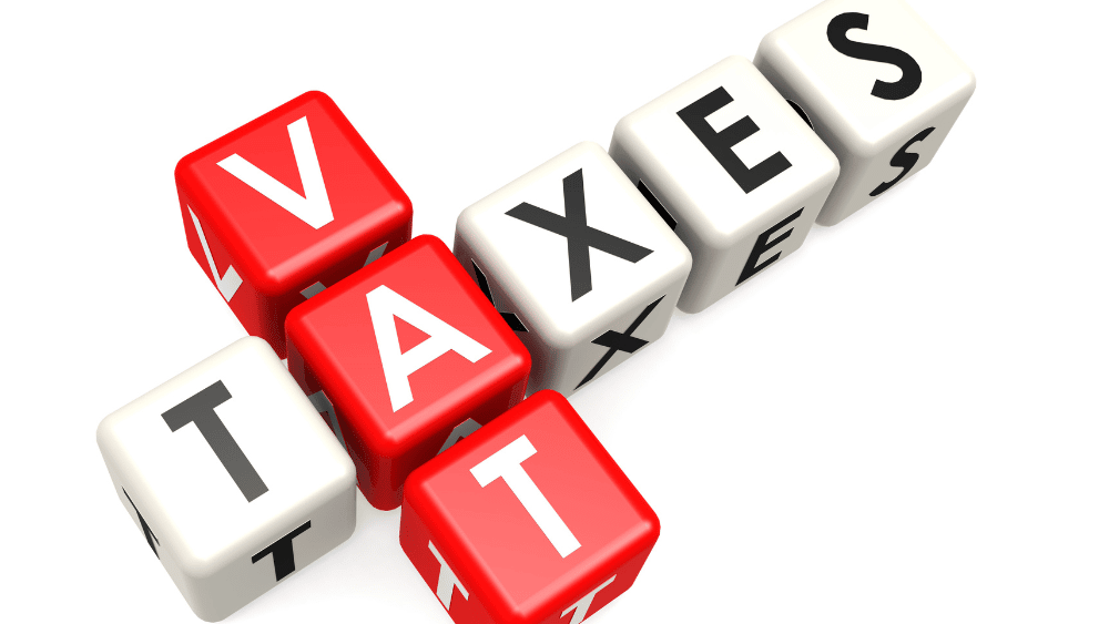Blocks spell out 'VAT' and 'taxes'